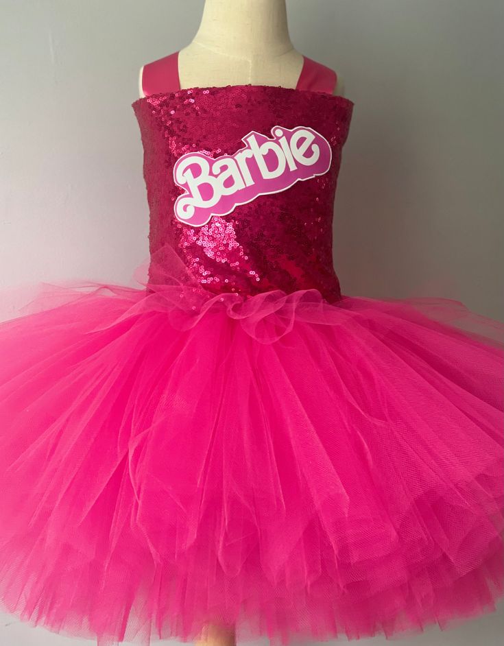 FREE SHIPPING on all orders within the US, no coupon code needed! Barbie Tutu by Little Ladybug Tutus. Handmade Tutus for girls specializing in birthday party dresses, Halloween costumes, flower girl dresses, pageant tutus, 1st birthday tutus, and blinged Converse sneakers. We accept custom orders! ORDER PRODUCTION TIME Please check the top of our website's home page for current turn around time. Since all items are handmade at the time of purchase, there is a production time that varies. We do Pink Dress For Halloween Dress-up, Cute Pink Tutu Dress For Costume Party, Cute Pink Princess Dress Costume, Pink Themed Costume For Party, Pink Themed Costume For Costume Party, Pink Fun Dress For Costume Party, Pink Fitted Tutu Dress For Costume Party, Fun Pink Dress For Costume Party, Cute Tutu Dress For Pageants