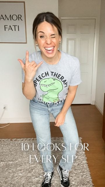 a woman sitting on top of a rug making the peace sign