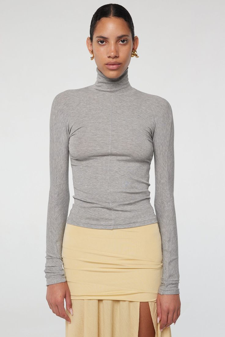 Blixa Turtleneck - Heather Grey | The Line by K Fitted High Neck Tops For Fall, Ribbed Mock Neck Top With Long Sleeves, Fitted Mock Neck Top For Fall, Ribbed Stretch Mock Neck Top With Long Sleeves, Versatile Turtleneck Long Sleeve Top For Fall, Stretch Tops With Thumbholes For Fall, Trendy Turtleneck Tops With Thumbholes, Versatile Fitted Turtleneck For Layering, Versatile Ribbed Turtleneck Tops