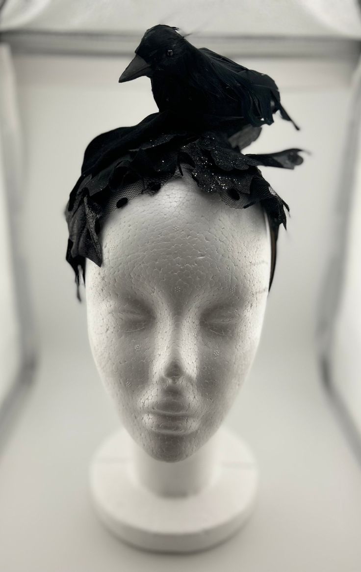 This black crow fascinator will step up your Halloween costume game. Pair it with an LBD, and all black outfit, or anything for that matter! You'll be the talk of the party...in the best way! This Fascinator is made with an artificial crow, glittered artificial leaves, black polka dot tulle, satin ribbon, and a satin headband. Everything is secured to the headband. The crow on this Fascinator is a bit smaller than the other posted crow fascinator.   This item was made in a smoke free home that i Black Costume Accessories For Winter Cosplay, Black Costume Accessories For Cosplay In Winter, Black Headband Fascinator For Party, Witchy Winter Party Costume Hats And Headpieces, Black Fitted Fascinator For Evening, Fitted Black Fascinator For Evening, Black Party Headband, Punk Black Costume Accessories For Winter, Punk Style Black Costume Accessories For Winter