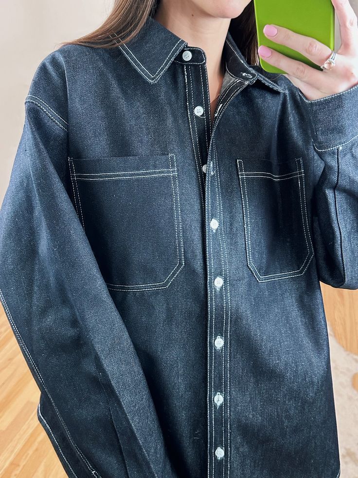 Meet your new go-to shacket! Throw on this oversized, dark wash denim button up over a dress or your favorite pair of jeans to add a chic flair to any outfit! Can even be worn as a dress if you're more petite. Have a little Canadian Tux moment and pair it with our Classic Dark Wash Jeans.100% Cotton Maclaine is 5'7 and wearing a size S/M. Spring Denim Shacket With Patch Pockets, Dark Wash Trendy Denim Top For Everyday, Trendy Dark Wash Denim Top For Everyday, Trendy Dark Wash Denim Top, Trendy Everyday Dark Wash Denim Top, Chic Dark Wash Button-up Outerwear, Everyday Denim Shacket, Collared Denim Jacket For Fall Day Out, Oversized Denim Shacket With Pockets