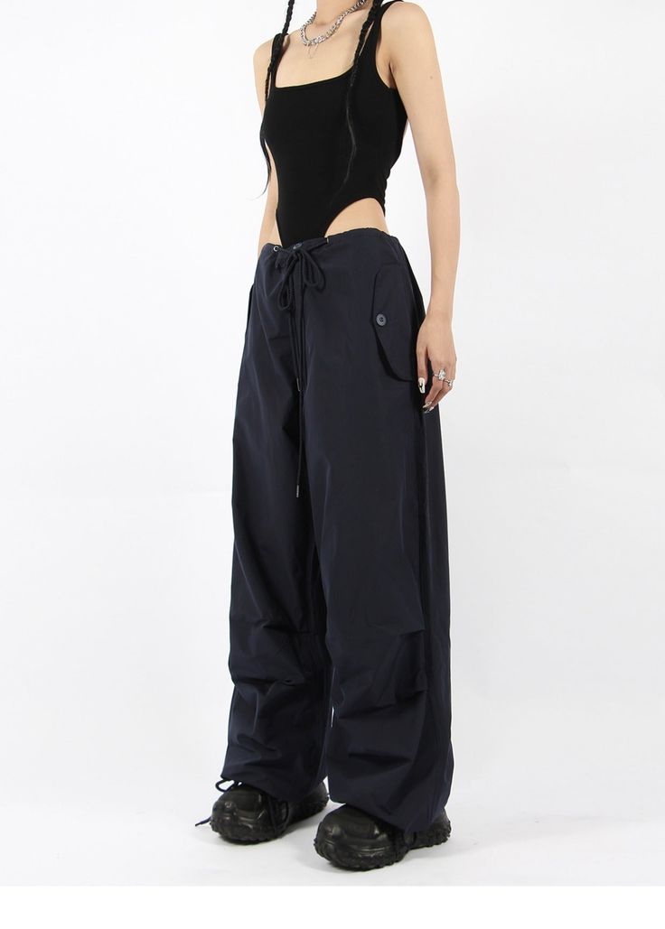 There’s a new trend in town, and it’s nightcity clothing’s Button Pocket Oversized Parachute Pants. These comfy, lightweight pants look great when paired with a crop top or graphic tee and sneakers. With a drawstring waistline, these pants are comfortable and secure, and the oversized fit gives them an effortless and chill look. Add these pants to your wardrobe, and you’ll never have a dull moment — you’ll always be ready for an impromptu night out, no matter how casual it might be.
Gender: Wome Versatile Wide-leg Parachute Pants For Streetwear, Versatile Wide Leg Parachute Pants For Streetwear, Chic Wide Leg Parachute Pants For Streetwear, Versatile High Waist Parachute Pants With Relaxed Fit, Chic High Waist Parachute Pants For Streetwear, Edgy Wide-leg Parachute Pants For Spring, Edgy Wide Leg Parachute Pants For Spring, High Waist Cargo Pants For Summer Night Out, High Waist Cargo Pants For Night Out In Summer