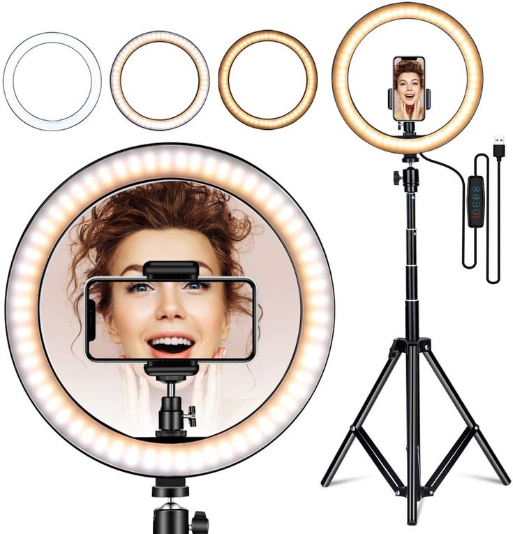 an image of a woman's face in the middle of a camera with lights and tripod