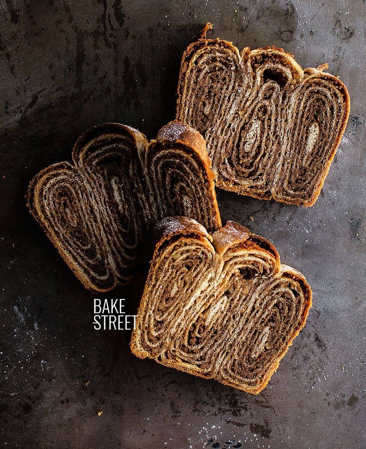 three slices of cinnamon swirl bread on a table