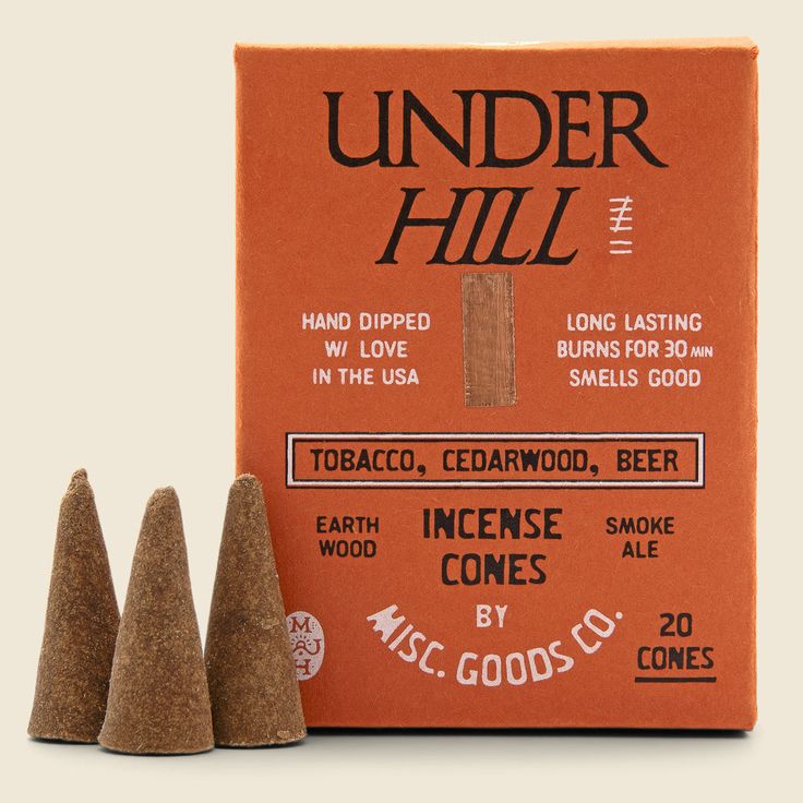 three cones in front of an orange box with the words under hill written on it