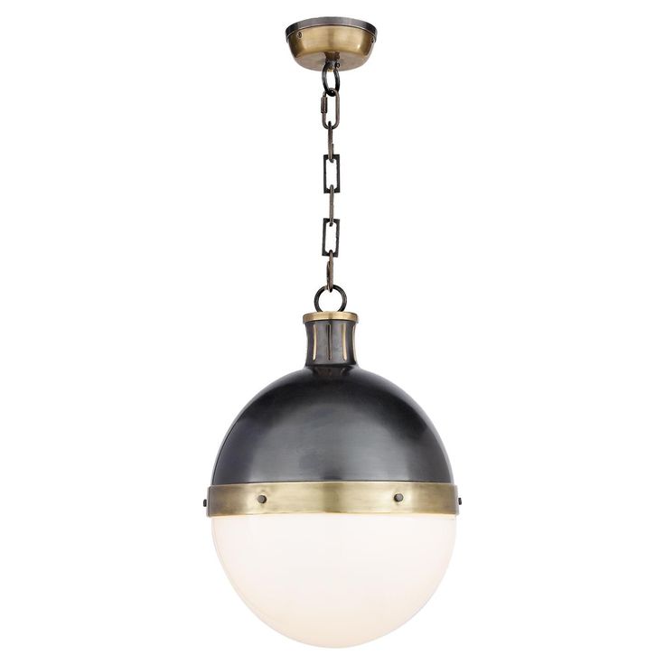 an antique brass and black pendant light with chain hanging from the ceiling, isolated against a white background