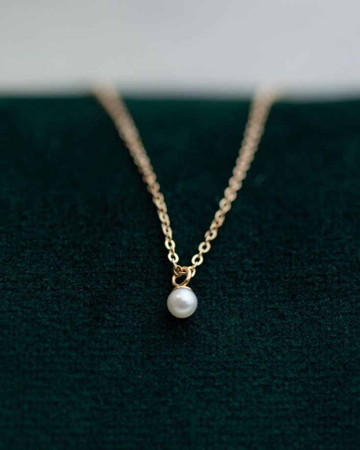 This Mini Pearl Pendant Necklace is the perfect complement for your evening wear or casual wardrobe. Crafted from 14k gold, this delicate necklace features a small cultured pearl, lending it a minimalist and elegant look. With this classic and versatile accessory, you're sure to make a statement. Pearl size: 2.75-3mm 14k Yellow Gold Minimalist Everyday Pearl Necklace With Round Pendant, Classic 14k Gold Pearl Necklace With Round Pendant, Classic Pearl Necklace With Delicate Chain, Minimalist 14k Gold Necklace For Formal Occasions, Minimalist Pearl Necklace With Round Pendant, Classic Pearl Necklace With Round Pendant And Delicate Chain, Dainty Pearl Chain Necklace For Formal Occasions, Classic 14k Gold Necklace With Pearl Charm, Classic 14k Gold Pendant Pearl Necklace