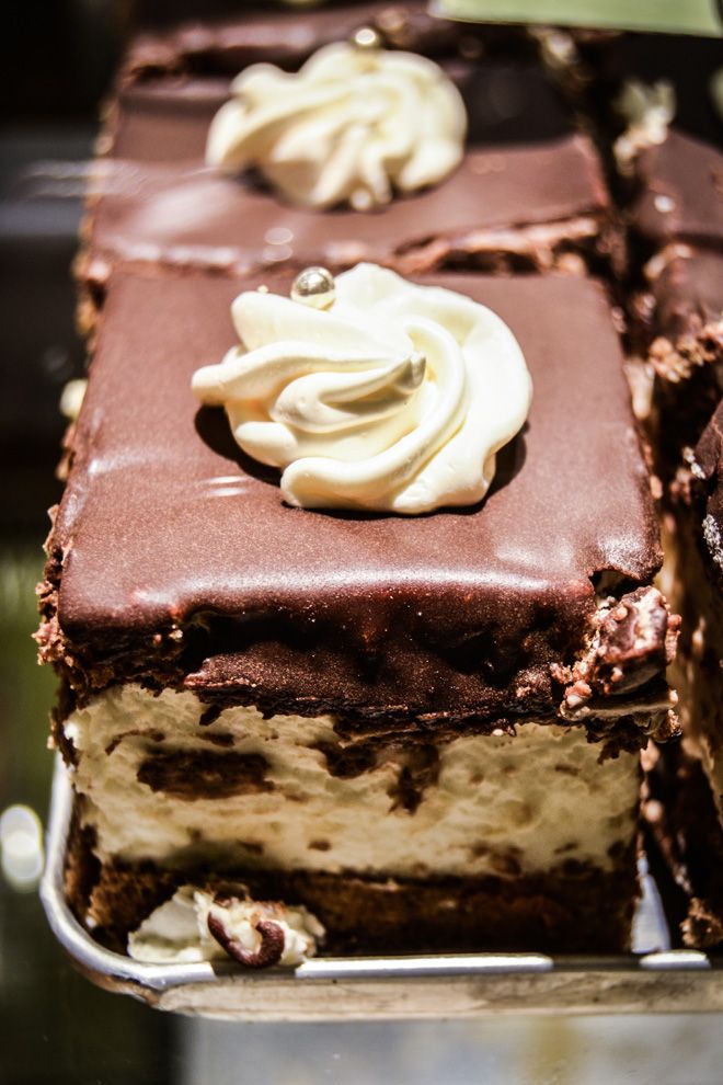 a chocolate cake with white frosting on top