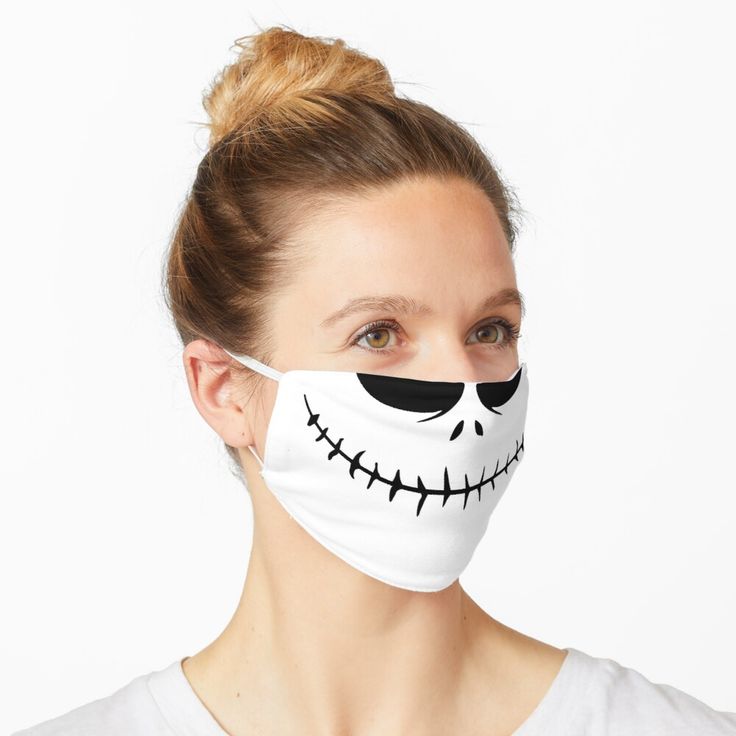 a woman wearing a white face mask with jack skellings on it's face