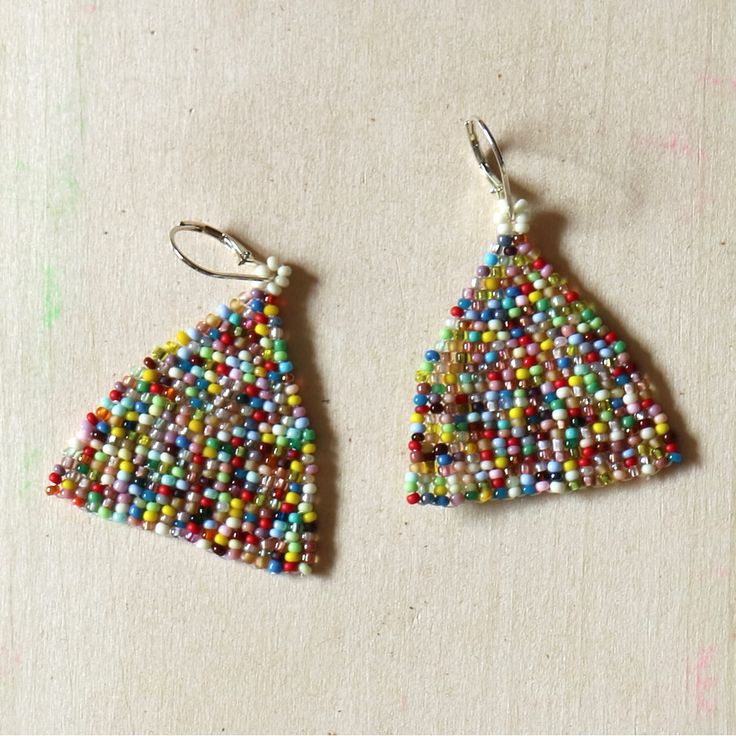 Small Batch Patchwork Handwoven Seed Bead Earrings Featuring: All Glass Seed Beads Curated Retro Rainbow Patchwork Vintage French Cream Band Lightweight + Fine Quality Sterling Silver Plated Leverbacks Handwoven On High Tenacity Nylon Approx 2.5" Long Approx 2" Wide Brand: Www.Karlymortensen.Com Vintage + Modern Materials Handwoven In Denver, Colorado Made To Order Please Allow 5 Days For Shipment Shop My Boutique For All Handmade Artist Items From My Studio Multicolor Handwoven Teardrop Earrings, Handwoven Multicolor Teardrop Earrings, Handwoven Multicolor Beaded Teardrop Earrings, Handmade White Triangle Beaded Earrings, Adjustable Multicolor Woven Beaded Earrings, Multicolor Woven Adjustable Beaded Earrings, Multicolor Woven Beaded Dangle Earrings, Cream Band, Rainbow Patchwork