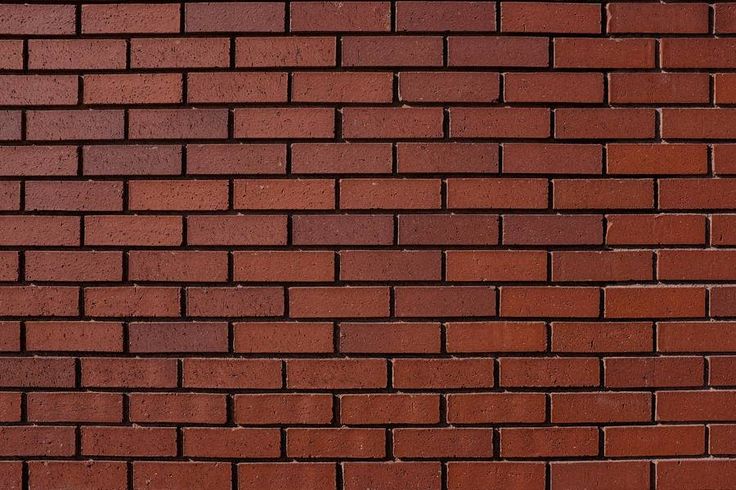 a red brick wall that is very close to the ground