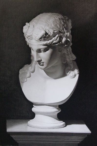 a black and white photo of a bust of a woman