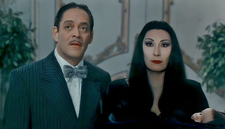 the addams are standing next to each other