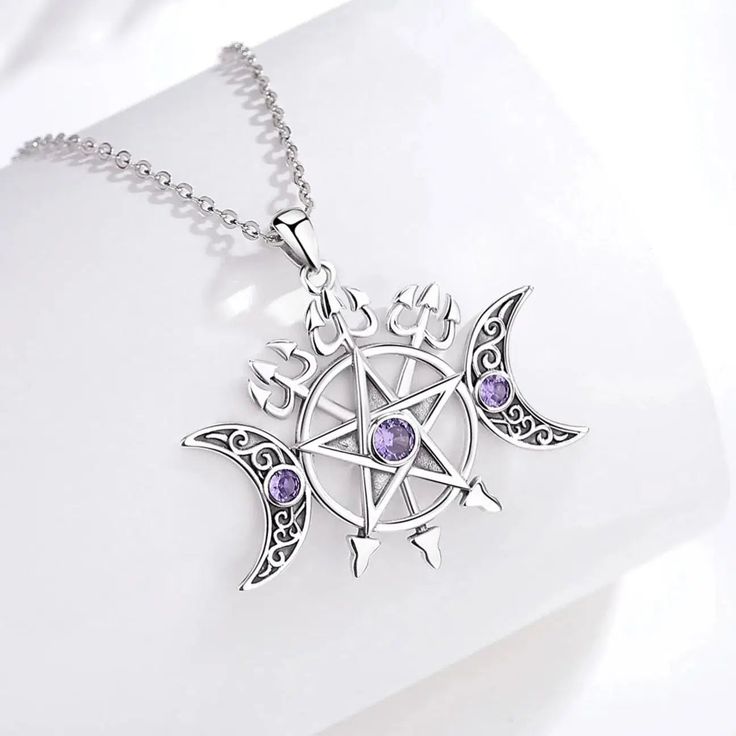 Connect with divine energy and bring your magic to life with this stunning Triple Moon Pentagram Necklace. Crafted with hypoallergenic sterling silver that's free of nickel, lead, and cadmium, this Wicca Pagan Jewelry is made to last—letting you enjoy its beauty for years! Have confidence in its high-quality and show up to the world, looking simply magical ☪️ Pendant Size: 35.6*26.6mm；Weight:6.5g; Chain size: 18 inch ( 46cm) ,Chain width 1.1 mm Package: Package Included (To Choose one of 3 Diffe Triple Moon Pentagram, Triple Goddess Necklace, Magical Pendant, Pentacle Jewelry, Pentagram Jewelry, Moon Pentagram, Pentacle Necklace, Moon Pentacle, Moon Goddess Necklace