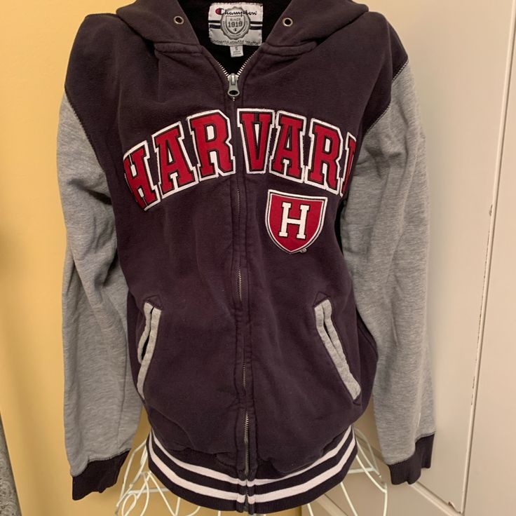 Champion Authentic Athletic Apparel Size Small. Nice Colors Navy Blue And Grey With Standout Harvard Lettering And Harvard Emblem. Is Super Cute With Any Outfit. Will Be A Favorite Collegiate Long Sleeve Track Jacket For Winter, Varsity Hooded Outerwear For Campus, Hooded Varsity Outerwear For Campus, Hooded Outerwear For Campus In Fall, Collegiate Long Sleeve Track Jacket For Fall, Collegiate Long Sleeve Cotton Outerwear, Collegiate Hooded Outerwear For Fall, Varsity Hooded Jacket For College In Fall, Fall Campus Long Sleeve Outerwear