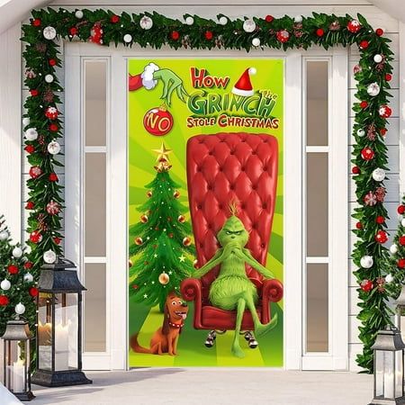 the grinch door cover is decorated with christmas decorations