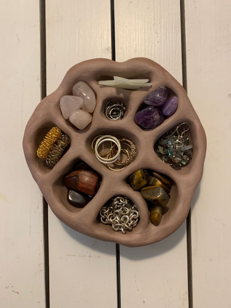 a bowl with rocks and stones in it