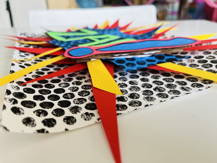 a paper kite is sitting on a table