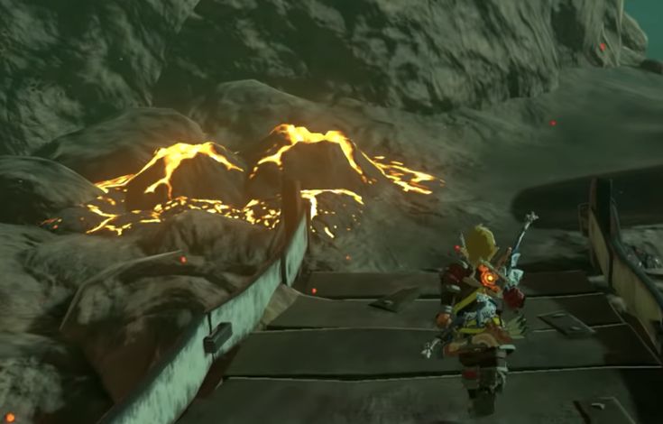 a video game character walking across a bridge in front of lava covered mountains and volcanos