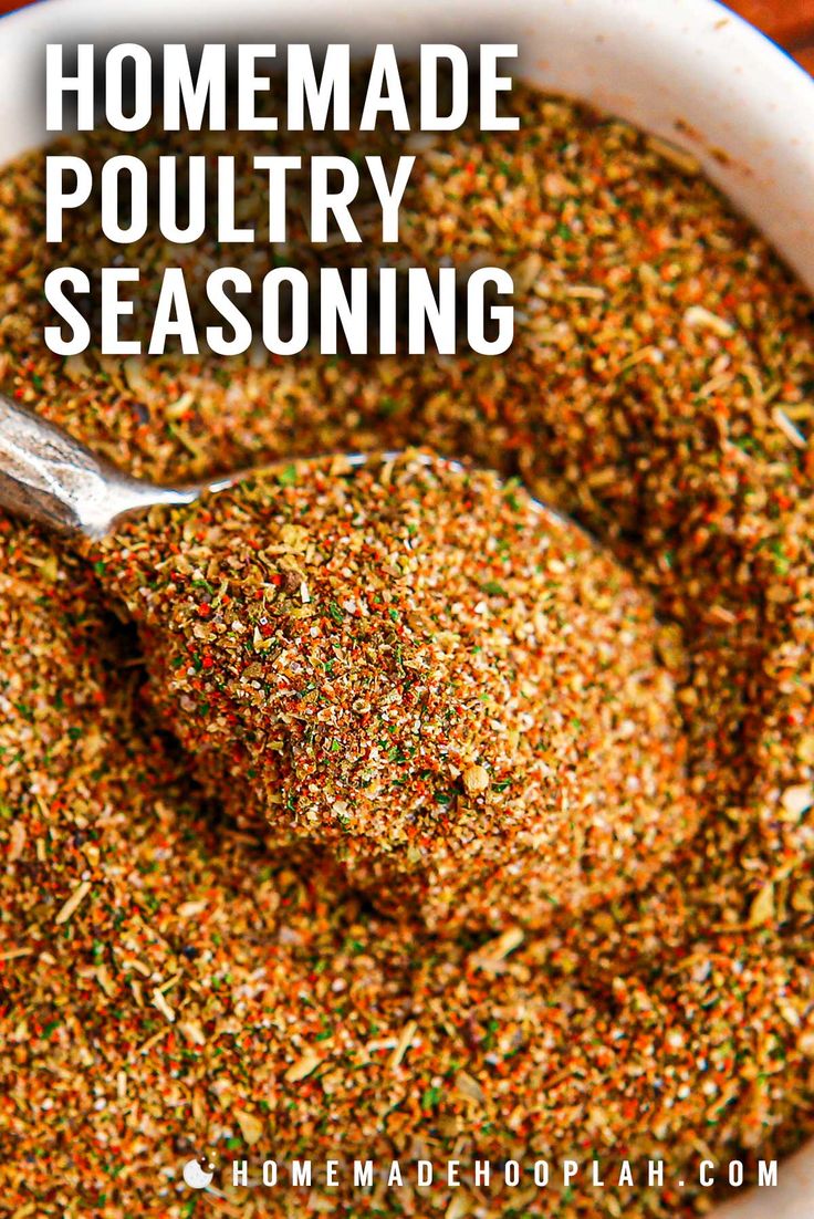 homemade poultry seasoning in a white bowl with a spoon on top and text overlay that reads homemade poultry seasoning