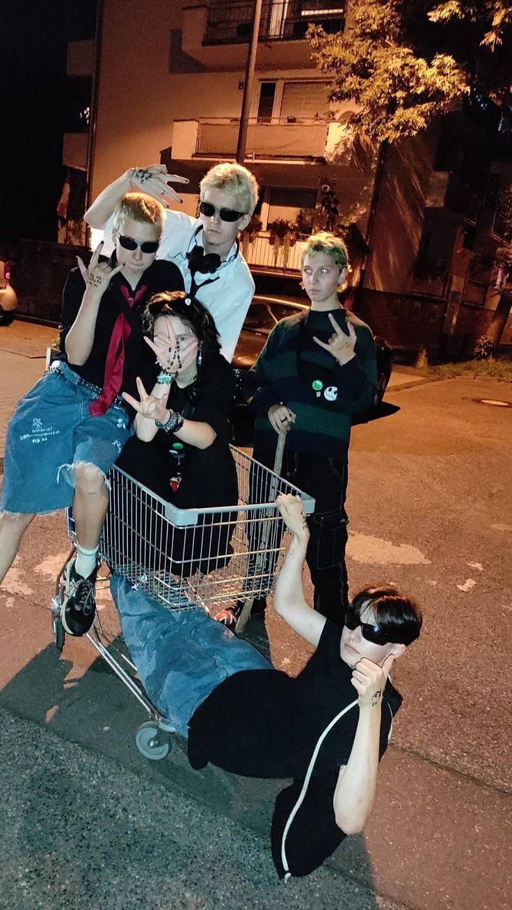 a group of people that are sitting in a shopping cart