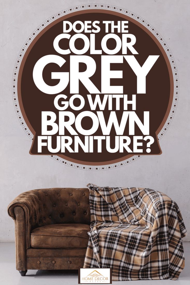 a couch sitting in front of a wall with the words does the color grey go with brown furniture?