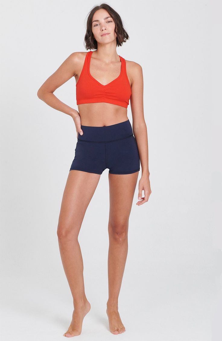 From hot yoga to a jog in the sunshine, these shorts will never let you down. Waistband option to roll down or wear high. Soft 4 way stretch fabric deliver great comfort and versatility! 92% Cotton, 8% Lycra. Made in USA. Hand Dyed. Outer Seam: 25.5"Colors: Navy, Black, Stella Blue Model is 5'9," size 4, and wearing a size small. Shown with the Raja Bra Athleisure Athletic Fit Yoga Shorts, Casual 4-way Stretch Biker Shorts For Yoga, Versatile Athletic Shorts For Summer Gym, Versatile Summer Gym Athletic Shorts, Navy Sportswear Shorts, Navy Short Activewear Sportswear, Casual 4-way Stretch Yoga Shorts, Sporty Stretch Navy Shorts, Navy Activewear With Built-in Shorts For Gym