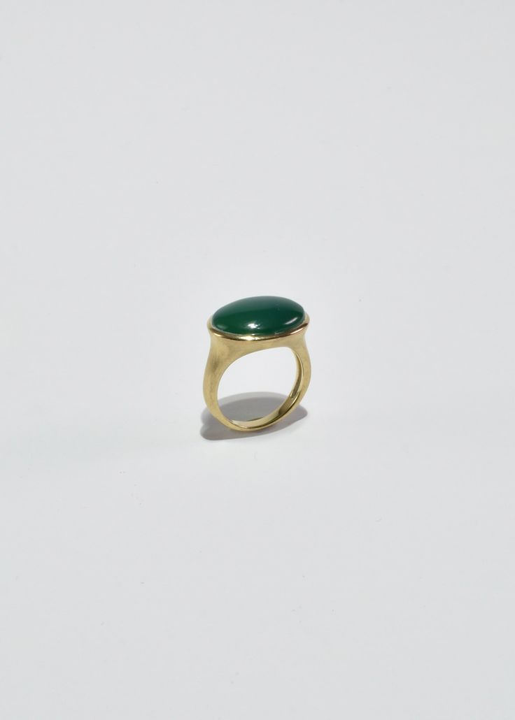 Vintage gold vermeil ring with polished oval jade cabochon. Stamped 925, China, LIRM. Material: Sterling silver, gold vermeil, jade. We recommend storing in a dry place and periodic polishing with a cloth. Gold Ring With Large Oval Cabochon Stone, Oval Jade Rings In Yellow Gold, Yellow Gold Oval Dome Ring In Brass, Green Oval Dome Ring With Polished Finish, Elegant Oval Brass Dome Ring, Timeless Green Oval Signet Ring, Classic Gold Rings With Jade, Oval Brass Rings With Polished Finish, Gold Jade Ring With Polished Finish