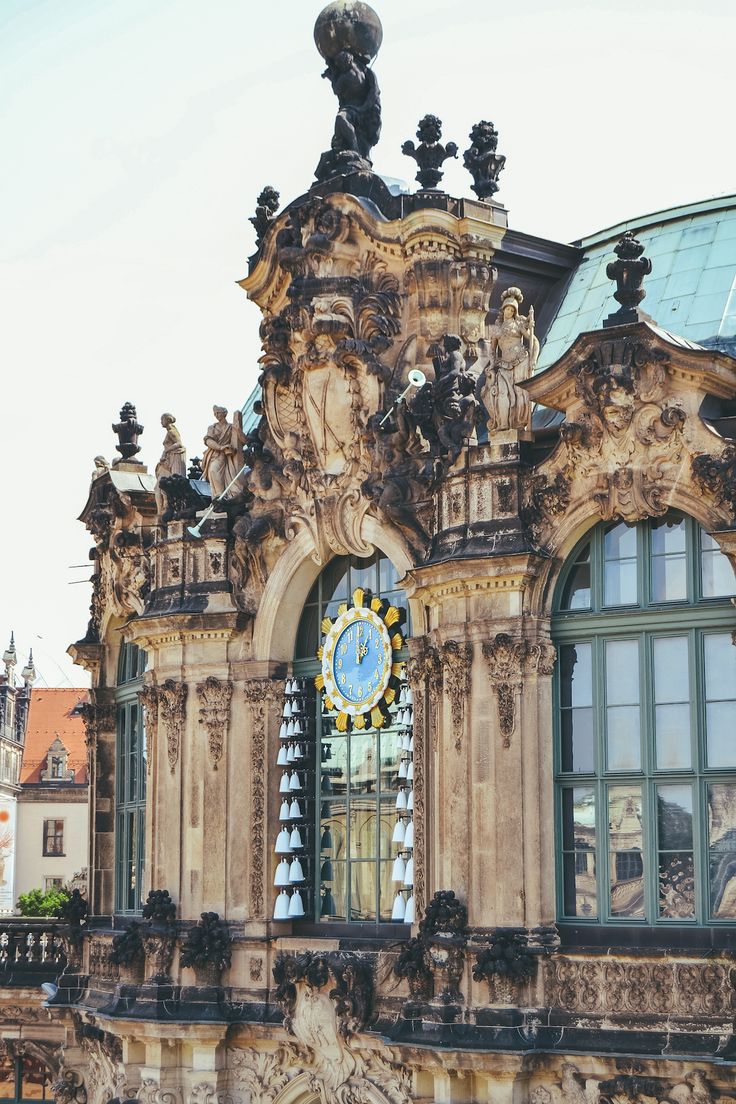 an ornate building with a clock on the front