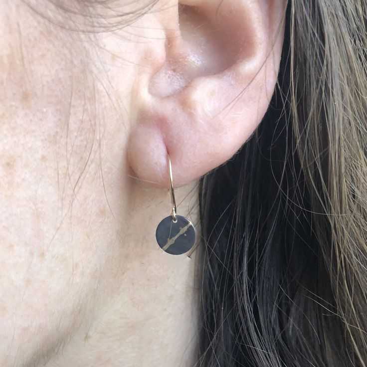 This collection is inspired by the ancient Japanese technique of kintsugi, where something, traditionally pottery is repaired with gold. Each sterling silver piece is sawed in half and soldered back together with 14k gold to highlight the break as a new part of the whole, and make it stronger than it was originally. Sterling silver and 14k yellow gold discs dangle from handmade gold filled earring wires. Each piece is packed with a card describing the process and inspiration behind this collecti Silver Earrings With Recycled Gold For Gift, Silver Earrings With Recycled Gold As A Gift, Sterling Silver Jewelry For Everyday, Nickel Free Bronze Minimalist Jewelry, Minimalist Nickel-free Bronze Jewelry, Nickel-free Minimalist Bronze Jewelry, Everyday Sterling Silver Jewelry, Artisan Yellow Gold Nickel-free Jewelry, Artisan Nickel-free Yellow Gold Jewelry