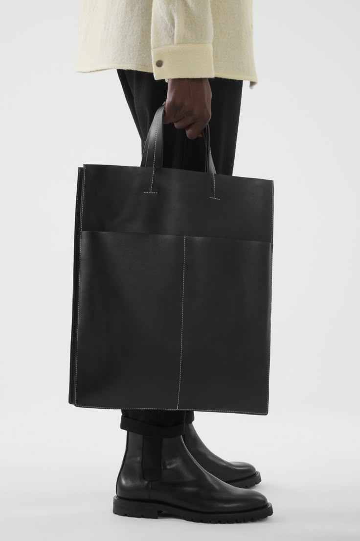 LEATHER TOTE BAG - BLACK - Bags - COS US Mens Leather Tote Bag, Minimalist Bags Design, Mens Tote Bag, Leather Bag Design, Soft Leather Tote, Contrast Topstitching, Men's Totes, Oversized Tote Bag, Black Leather Tote Bag