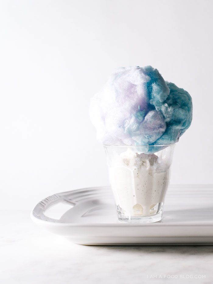 a cup filled with cotton sitting on top of a white plate