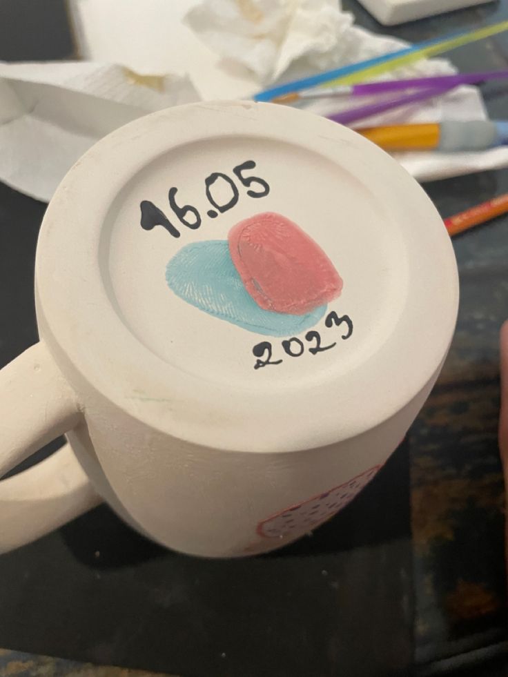 a coffee cup that has been decorated with the year 2013