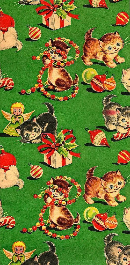 a green background with kittens and christmas decorations