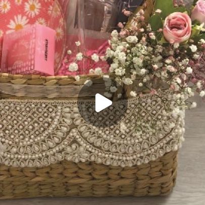 a basket filled with flowers sitting on top of a table