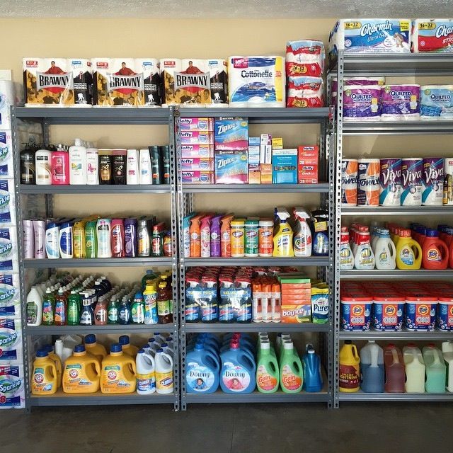 several shelves filled with different types of cleaning products