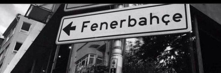 black and white photograph of a street sign with the word fenerbaache on it