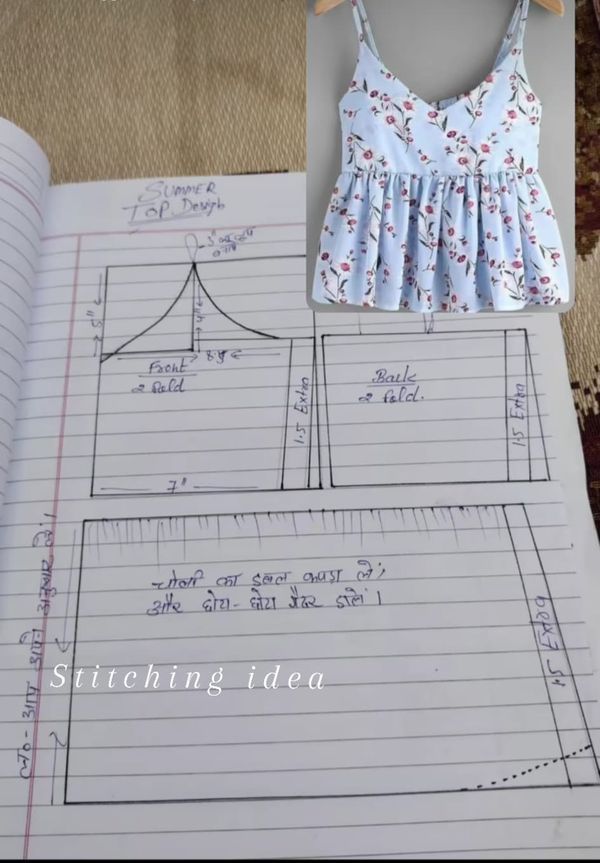 an open book with drawings on it next to a sewing pattern for a top and skirt