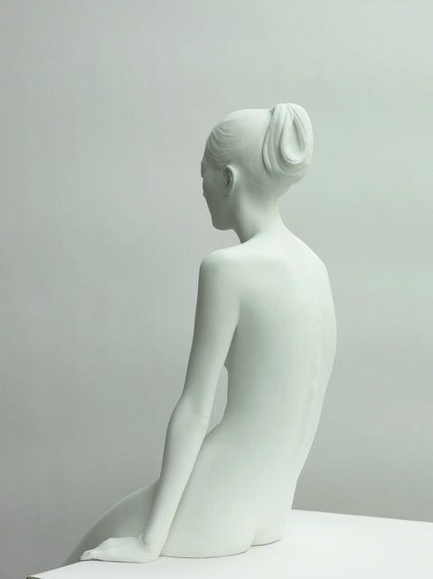 a white sculpture sitting on top of a table