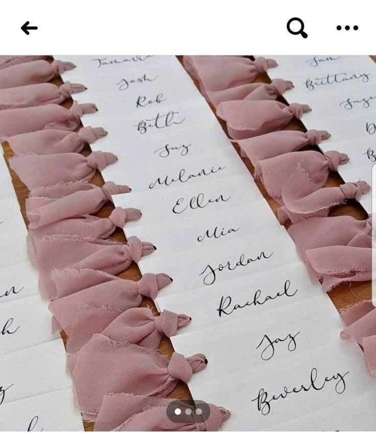 several pieces of paper with pink ruffles on them are lined up next to each other