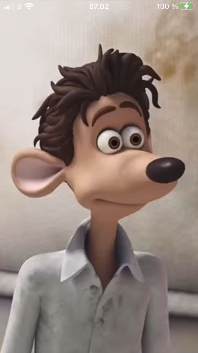 a cartoon character with big eyes wearing a gray shirt