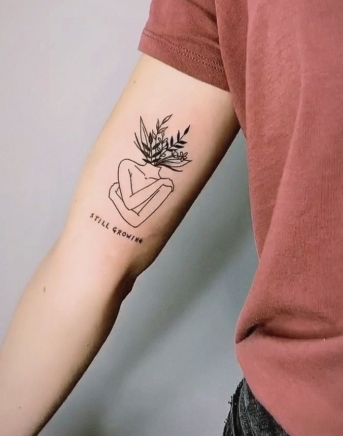 a person with a small tattoo on their arm