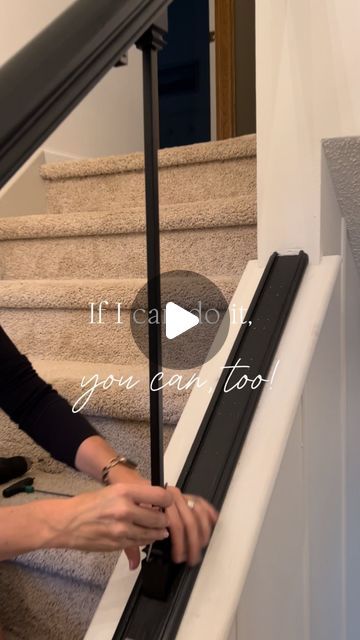 a woman is working on the stairs with her hand