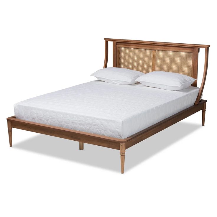 the headboard and foot board are made from wood, with white pillows on top