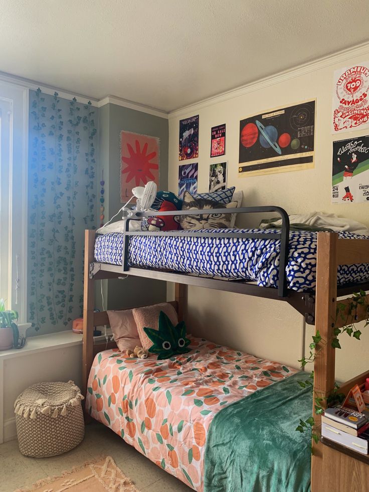 a bunk bed sitting next to a window in a bedroom