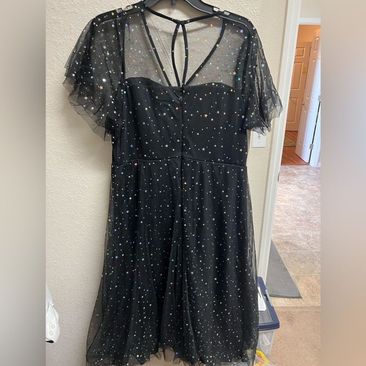 Torrid Midi Dress With Black Tulle Over A Slip. Illusion Neckline. Iridescent Star Pattern. Never Worn. Size 14. Black Shimmer Dresses For Prom, Black Shimmer Dress For Prom, Star Print Evening Dresses For Party Season, Elegant Star Print Evening Dress, Elegant Star Print Party Dresses, Elegant Evening Dress With Star Print, Star Print Dress For Party Season, Star Print Party Dress For Spring, Black Shimmer Holiday Dress