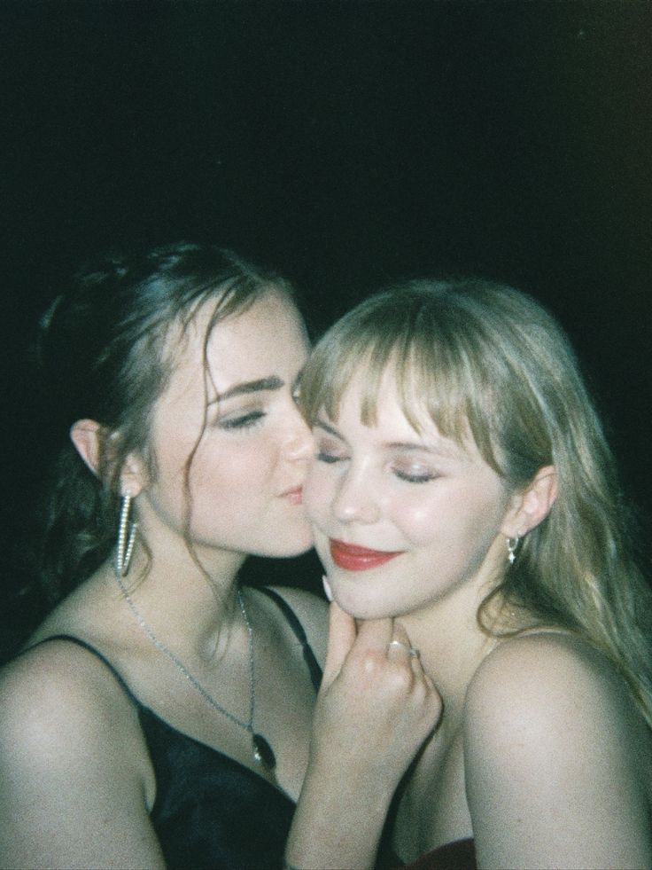 two women who are kissing each other