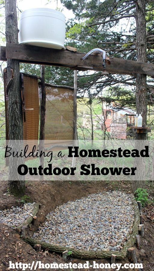 an outdoor shower in the woods with text overlay reading building a homestead outdoor shower