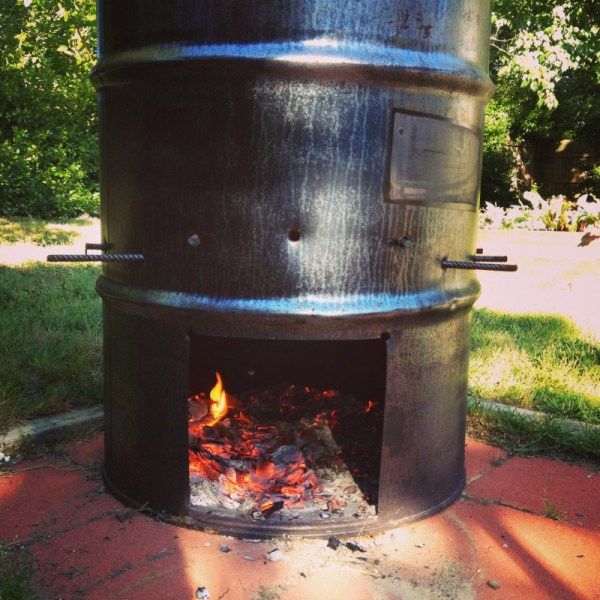 an outdoor fire pit is shown in the sun