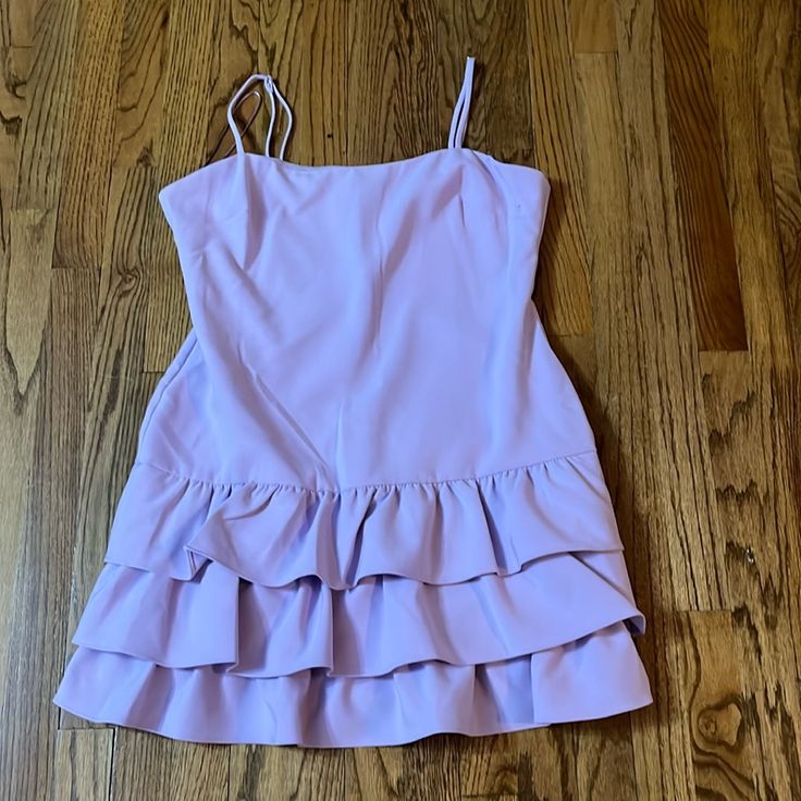 Brand New Lilac Mini Dress By Likely. Never Worn. Size 14 With Straps And Ruffles. Spring Formal Tiered Mini Dress, Lavender Tiered Party Dress, Chic Purple Tiered Mini Dress, Chic Tiered Purple Mini Dress, Chic Lavender Dress With Ruffle Hem, Fitted Lavender Dress With Ruffle Hem, Purple Fitted Tiered Mini Dress, Fitted Purple Tiered Mini Dress, Formal Purple Ruffled Mini Dress